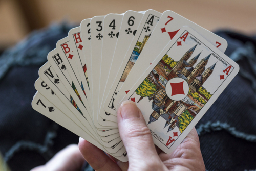 Hand holding playing cards